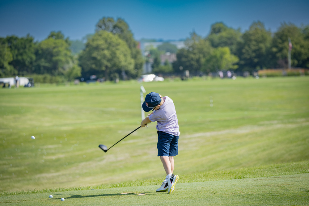 Child golfing
